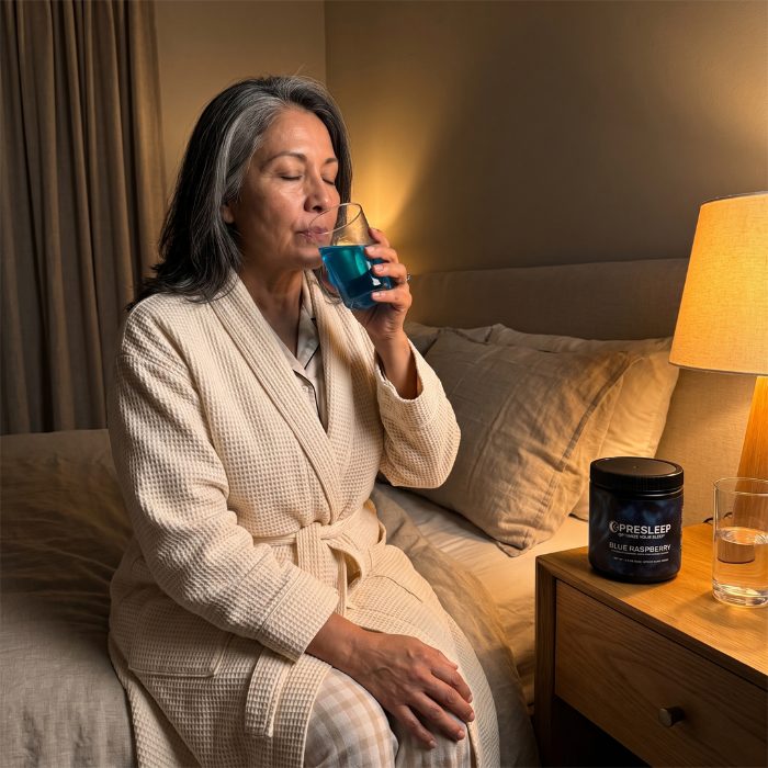 Woman calmly sipping PreSleep before bed