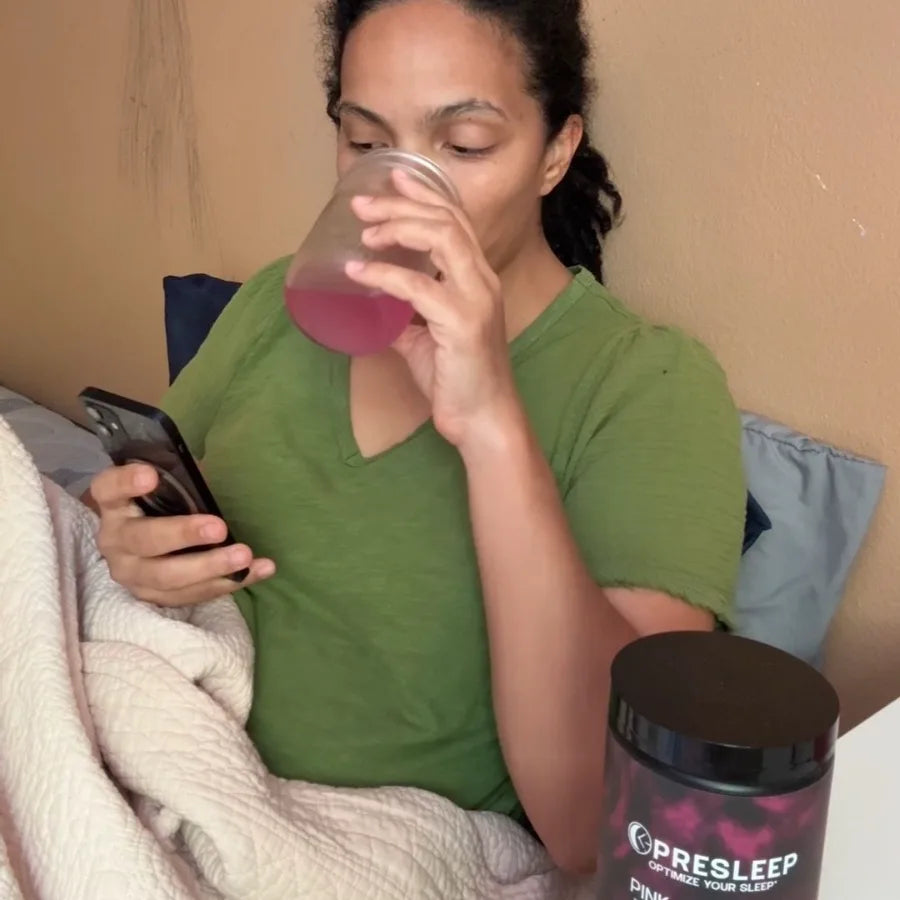 PreSleep customer sipping her drink in bed, jar on the nightstand