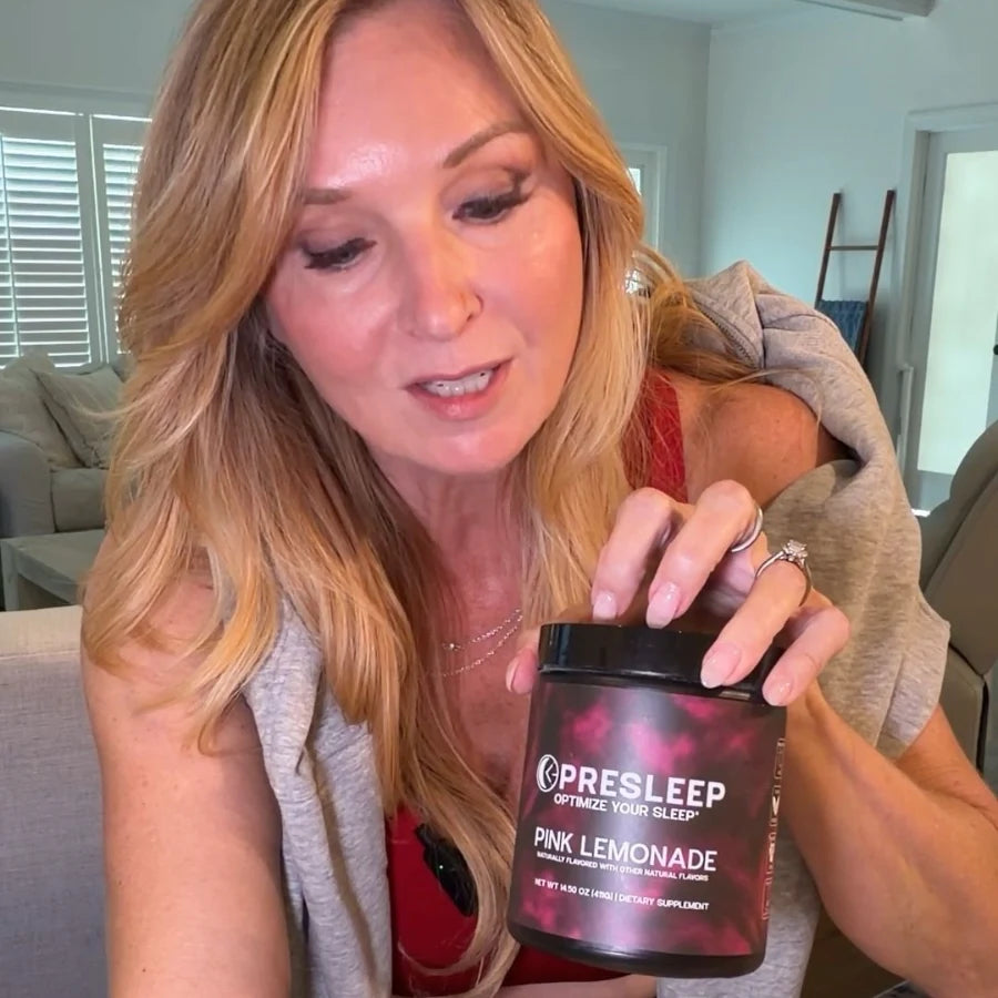 PreSleep customer relaxing on her couch with her jar of Pink Lemonade