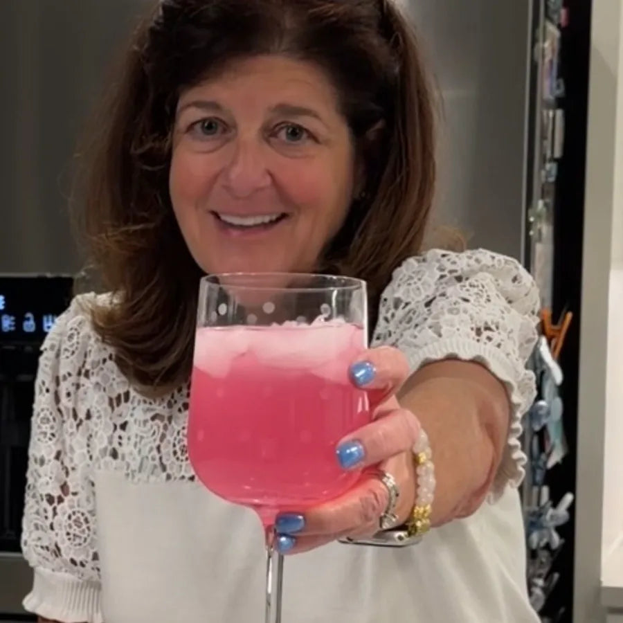PreSleep customer raising a glass of Pink Lemonade